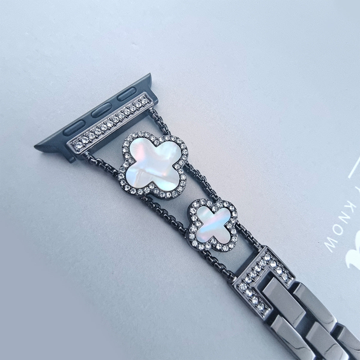 Close-up of rhinestone details on watch band image 3