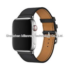 Model wearing Apple Watch with leather band