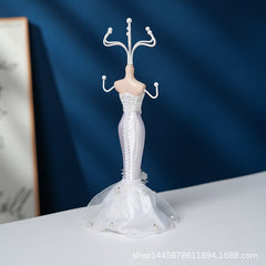 Stylish bracelet display on white jewellery stand