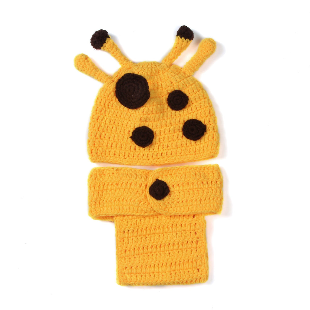 Child smiling in hand-knit giraffe outfit