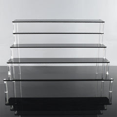 Transparent acrylic display stand showing organised items