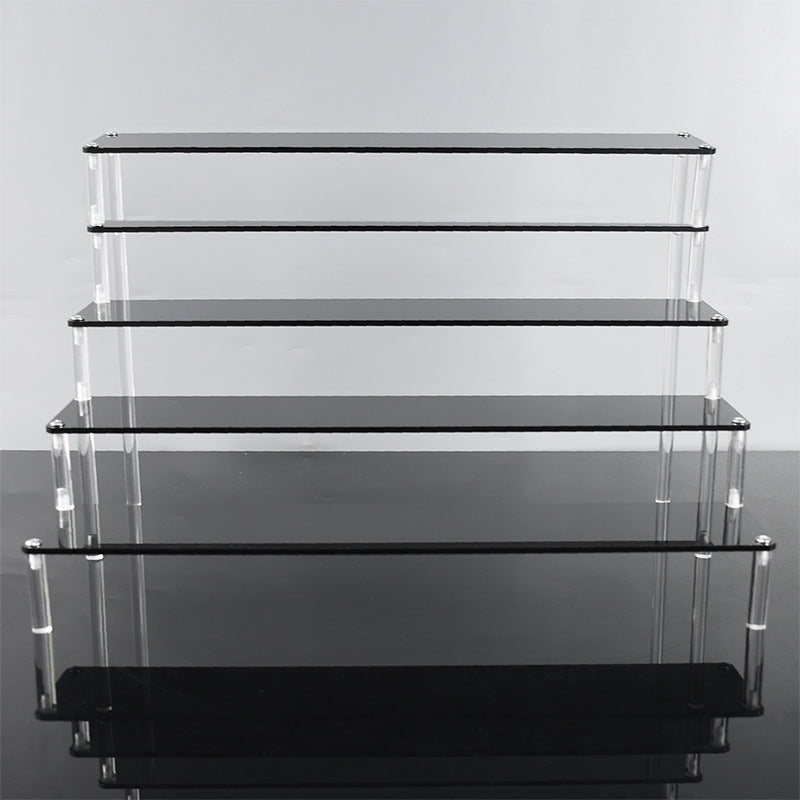 Transparent acrylic display stand showing organised items