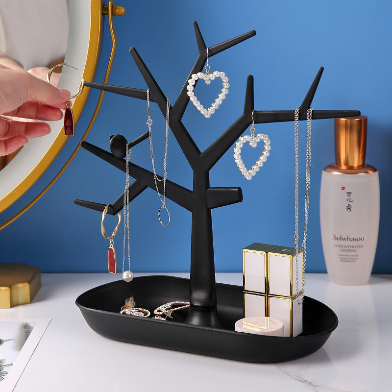 Stylish black and white jewelry tree on home vanity