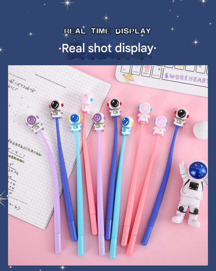 Set of astronaut-themed gel pens on a white background