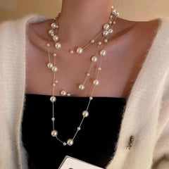 elegant long pearl necklace on display