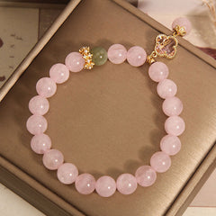 Natural Rose Quartz Bracelet displayed on a flat surface - image 5