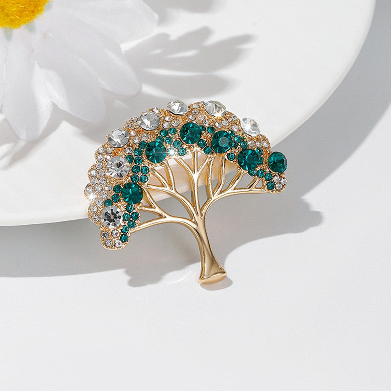 Close-up of a gold lucky tree brooch