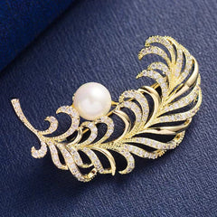 Close-up of Elegant Feather Brooch Pin in Gold