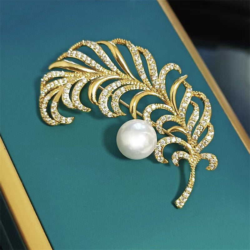 Close-up of Decorative Pin with Feather Motif
