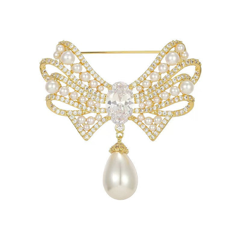 Elegant gold bow brooch on clothing