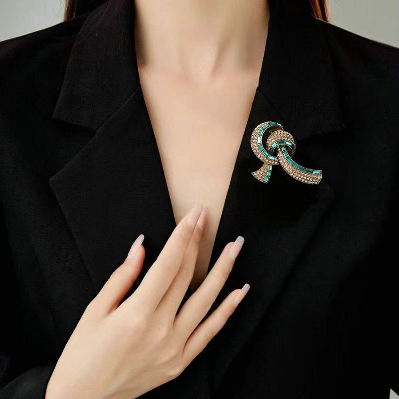 Close-up of Crystal Accented Bow Tie Brooch - Image 2