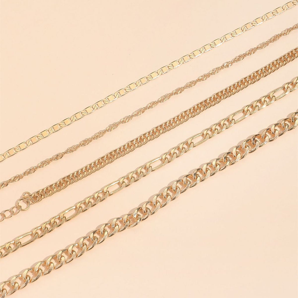 Stacked view of multiple snake chain anklets