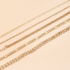 Stacked view of multiple snake chain anklets