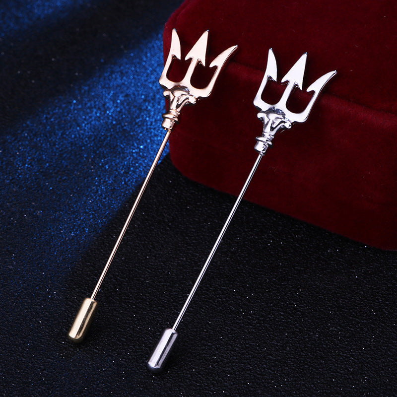 Stylish trident lapel pin displayed on a shirt