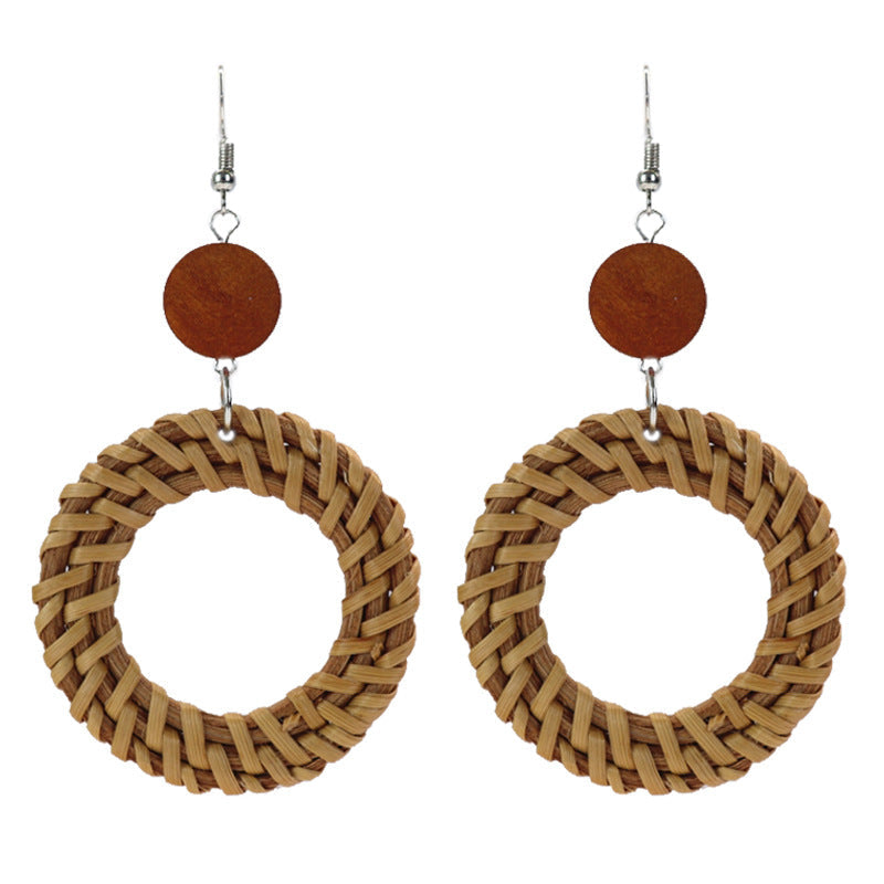 Unique woven earrings on a model