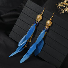 Closeup of stylish blue tassel earrings