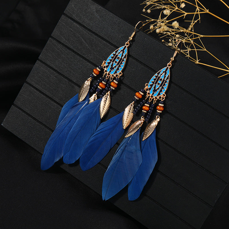Handcrafted earrings with feather details