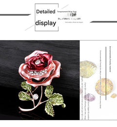 Floral brooch beside different colour variations