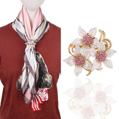 Floral rhinestone brooch on fabric