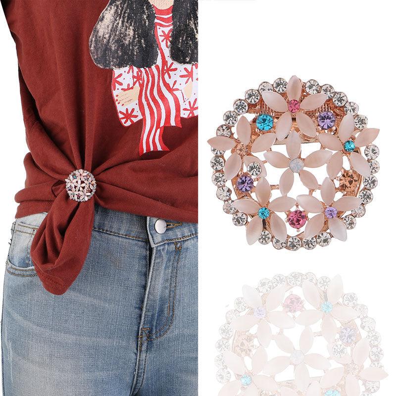Floral rhinestone brooch on fabric