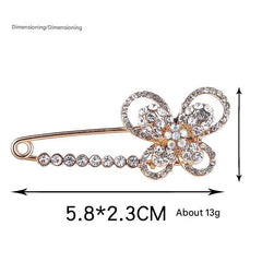Close-up of Decorative Brooch with Pearl Detail - Image 2