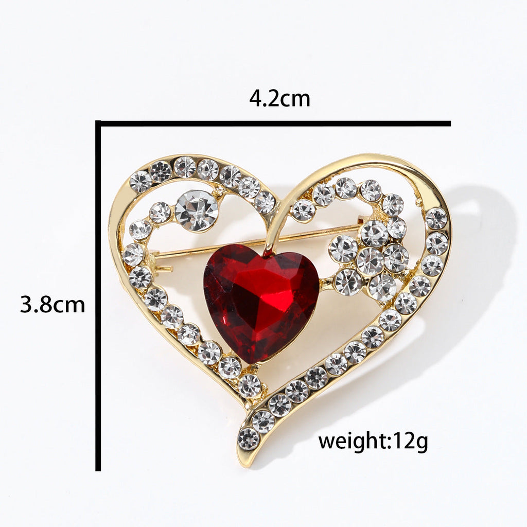 close-up of heart-shaped brooch