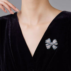 Gold Butterfly Knot Brooch styled on a sweater