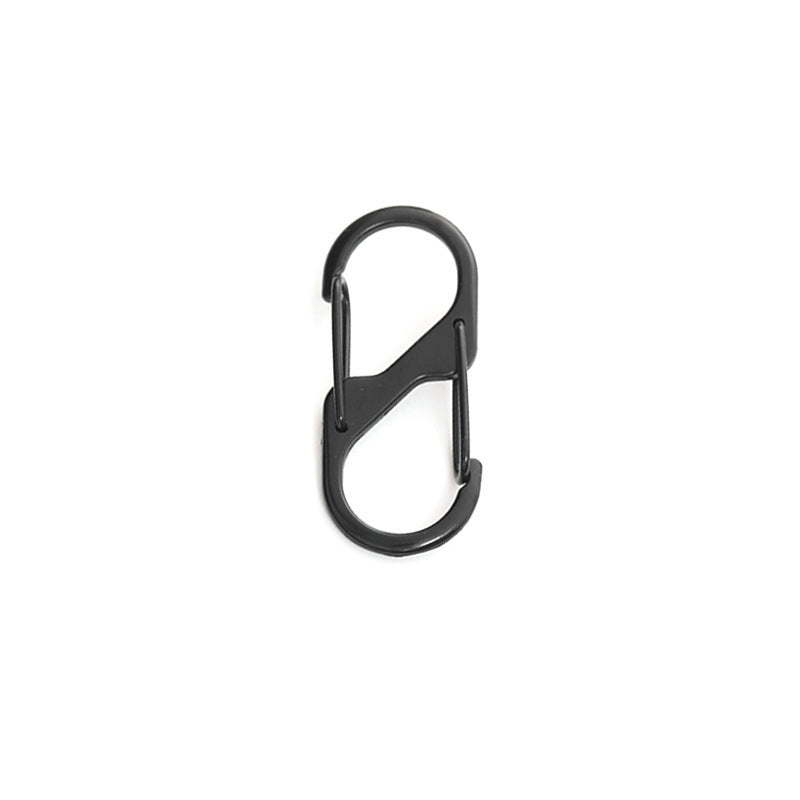 Versatile metal clip for bags and equipment