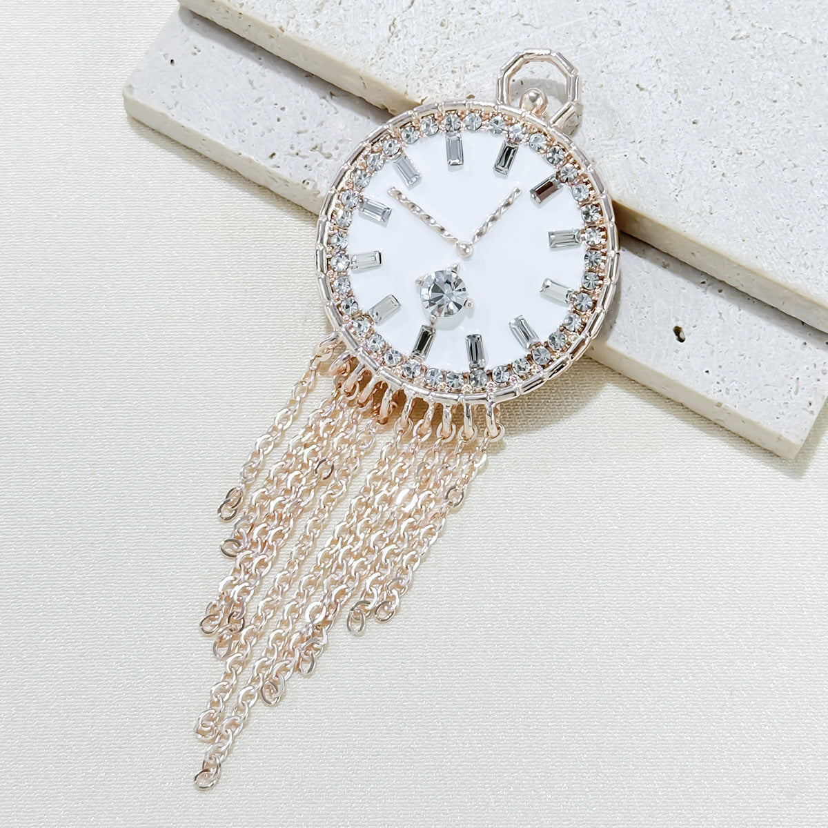 Close-up view of stylish rhinestone clock brooch