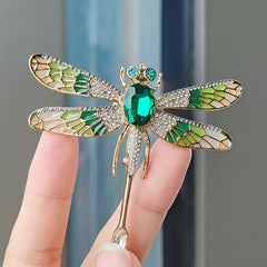 Elegant dragonfly brooch under light
