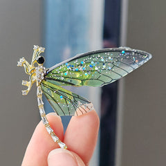Multiple vibrant dragonfly brooches for selection