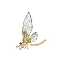 Acrylic dragonfly brooch in artistic design on a table