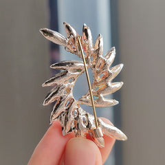 Elegant floral design brooch on fabric