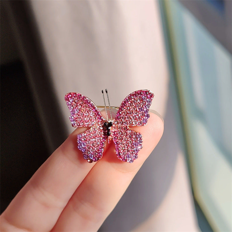 Close-up of the unique butterfly design on the brooch