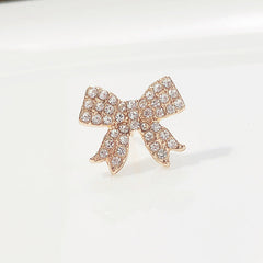 Elegant Clover Cat Eye Brooch Pin on fabric