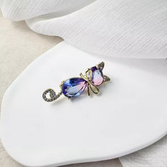 Cat brooch on elegant background