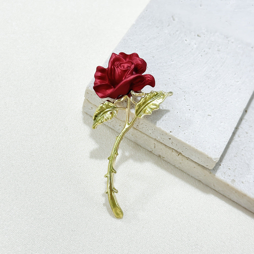 close-up of red rose brooch detail