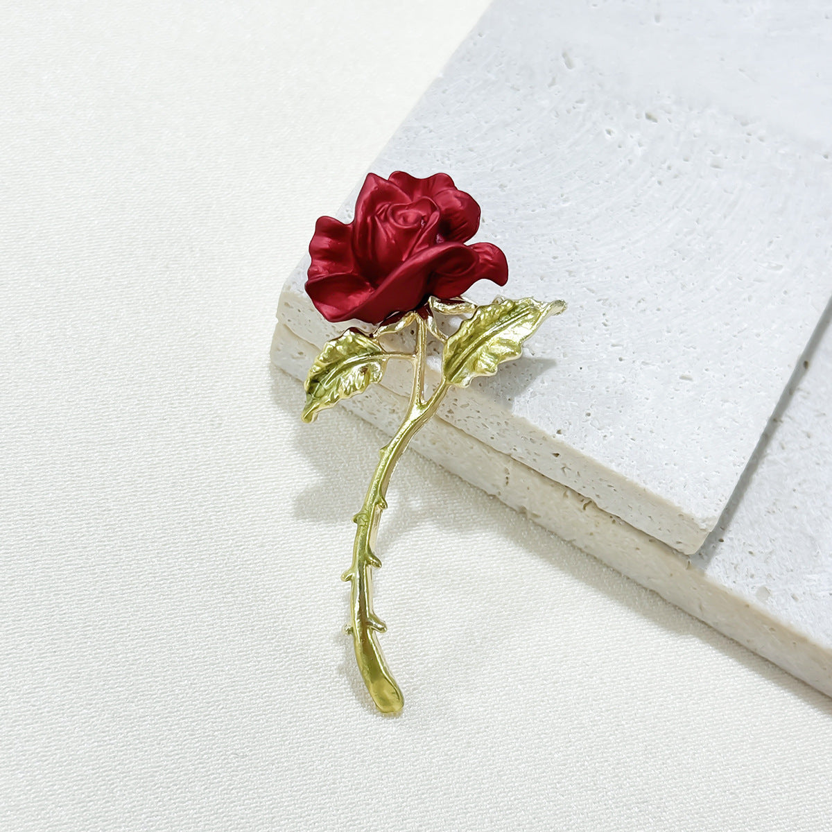 close-up of red rose brooch detail