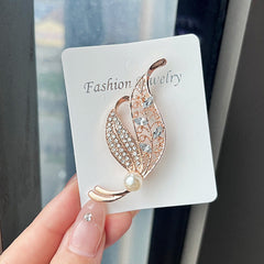 Accessory close-up featuring Leaf Brooch image 7