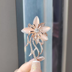 Purple floral brooch showcased elegantly
