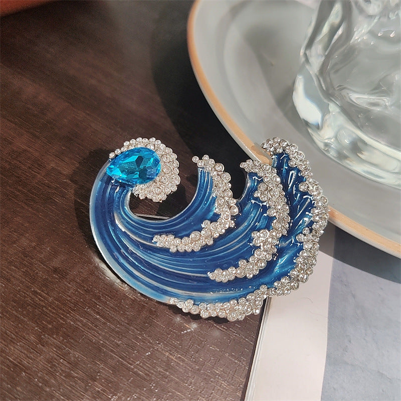 Wave design brooch on display
