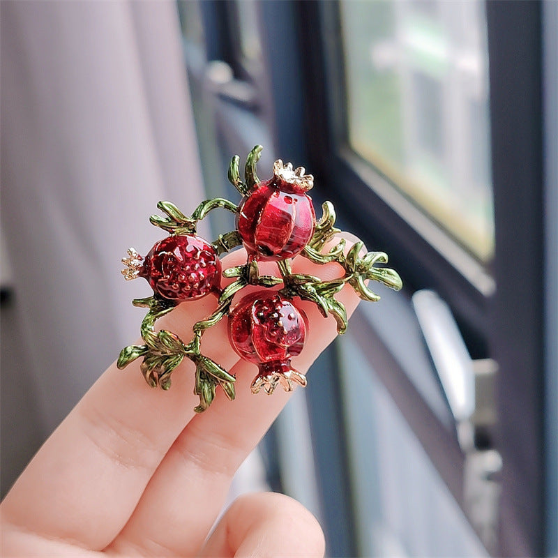 Retro fruit brooch featuring a cherry motif