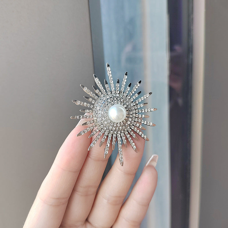 Versatile floral brooch securing scarf