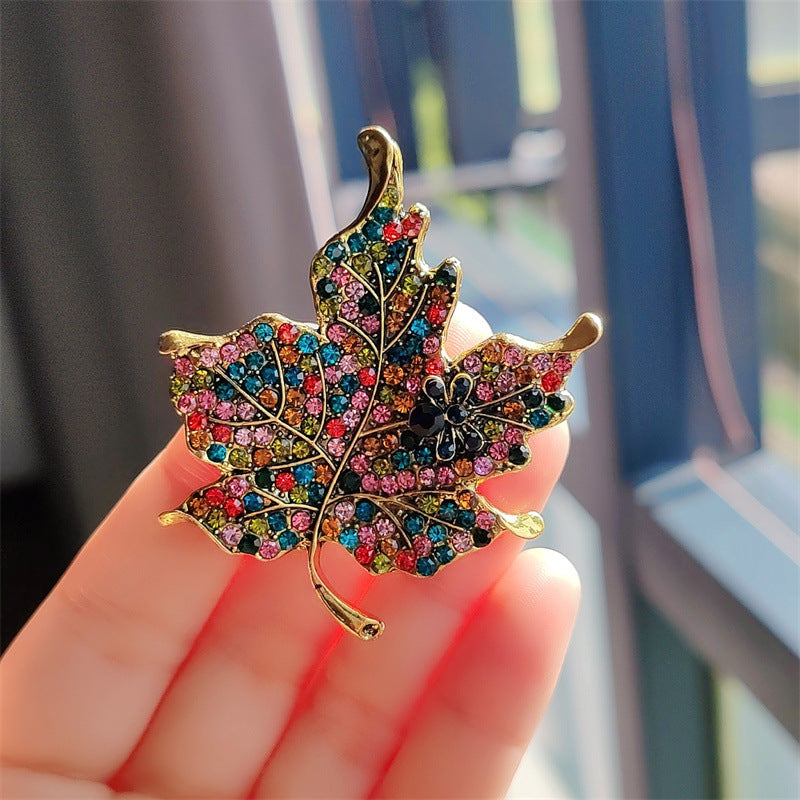 Brooch styled on a black fashion outfit