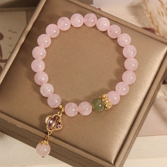 Elegant pink quartz bracelet with four leaf clover pendant