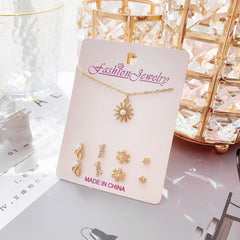 Set of minimalistic jewellery including necklace and earrings
