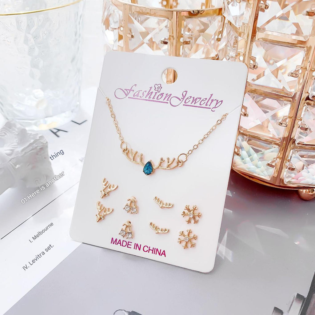 Set of minimalistic jewellery including necklace and earrings