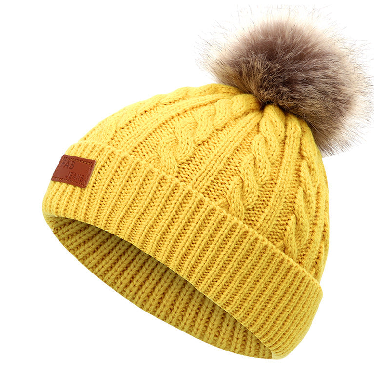 Cozy winter accessories for children on display