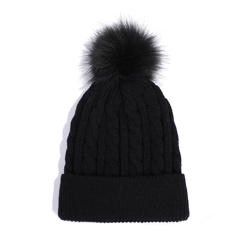 Red knit beanie hat with trendy pom pom