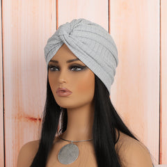 variety of colours of twist headwrap beanies on display